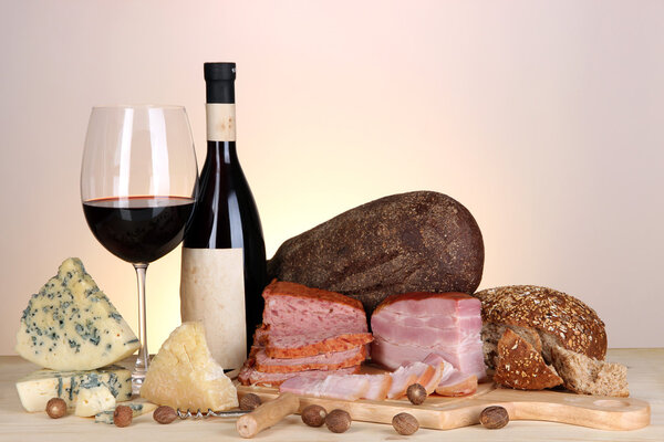 Exquisite still life of wine, cheese and meat products