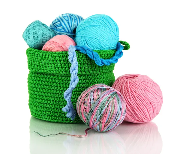 Colorful yarn for knitting in green basket isolated on white — Stock Photo, Image