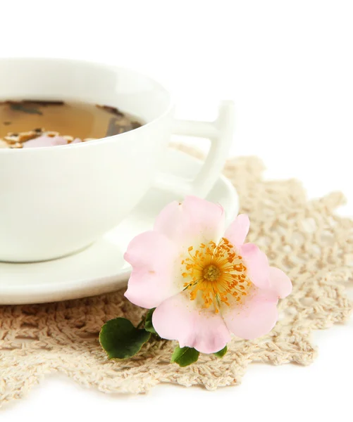 Cup of herbal tea with hip rose flowers, isolated on white — Stock Photo, Image