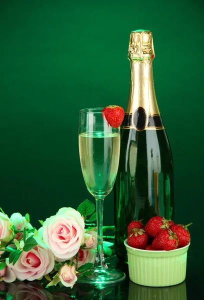 Romantic still life with champagne, strawberry and pink roses, on dark color background — Stock Photo, Image