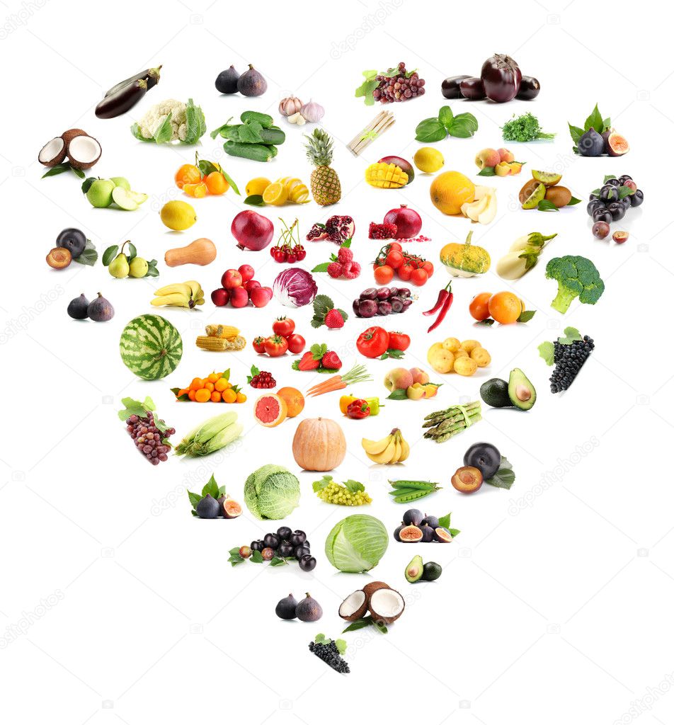 Heart made from various fruits and vegetables isolated on white