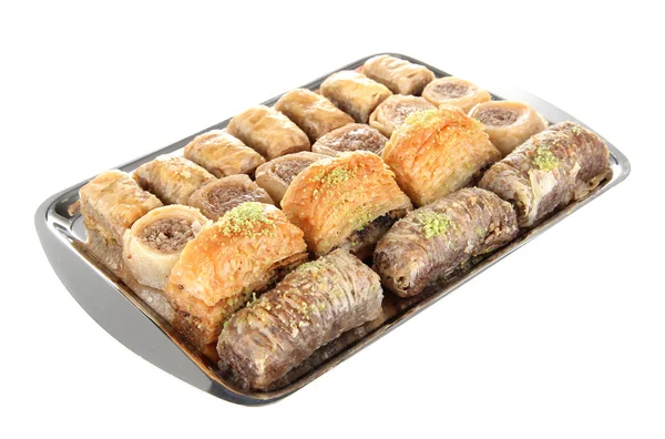 Sweet baklava on tray isolated on white — Stock Photo, Image