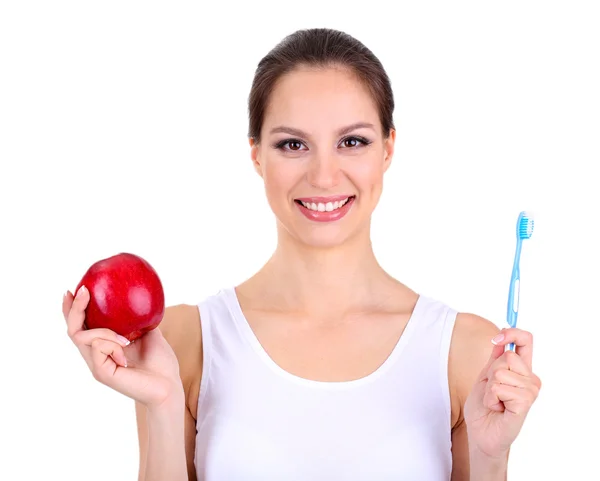 Χαμογελαστή γυναίκα με μήλο και οδοντόβουρτσα που απομονώνονται σε λευκό — Φωτογραφία Αρχείου