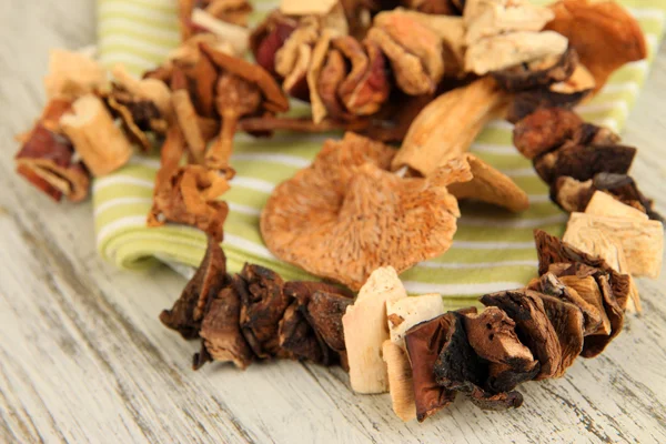 Dried mushrooms on wooden background — Stock Photo, Image