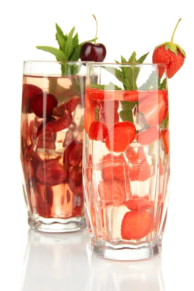 Glasses of fruit drinks with ice cubes isolated on white — Stock Photo, Image