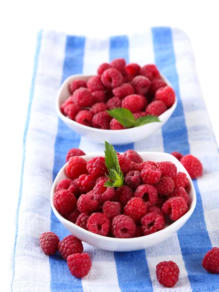 Ripe sweet raspberries in bowls, isolated on white — Stock Photo, Image