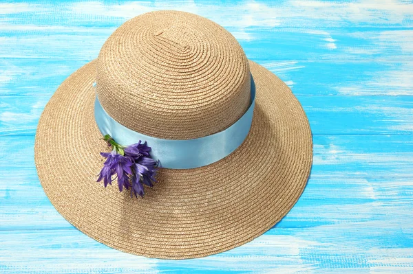 Beautiful summer hat on blue wooden background — Stock Photo, Image