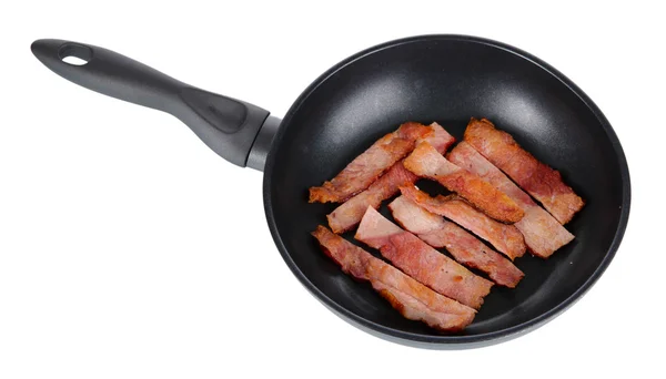 Fried bacon in frying pan isolated on white — Stock Photo, Image