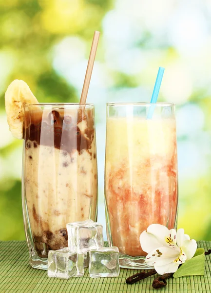 Delicious fruit smoothies on bright background — Stock Photo, Image