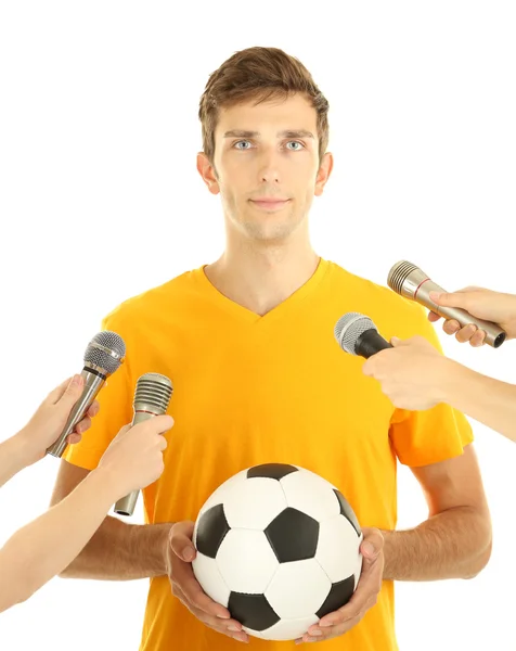 Interview with a young soccer player, isolated on white — ストック写真