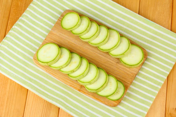 Fresh marrows on cutting board, on wooden background — Stock Photo, Image