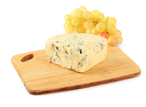 Tasty blue cheese and grape on cutting board, isolated on white — Stock Photo, Image