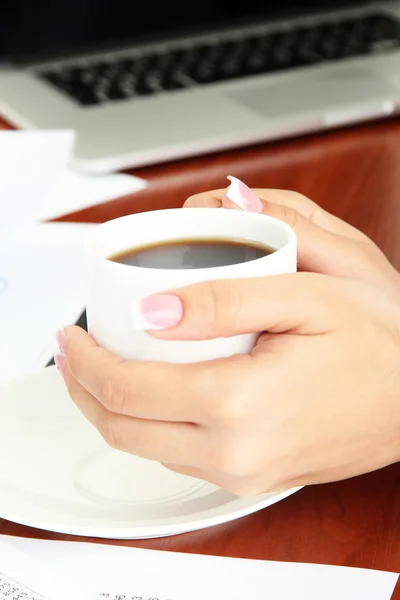 Close up of businesswoman hands with cup of coffee during teamwork — Stock Photo, Image