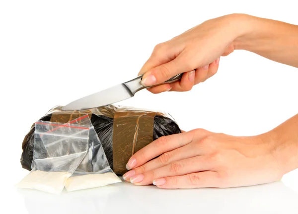 Pakketten van verdovende middelen in de hand geïsoleerd op wit — Stockfoto