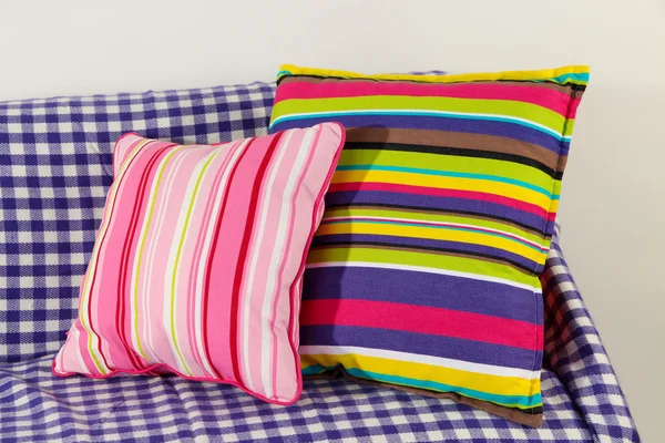 Colorful pillows on couch isolated on white — Stock Photo, Image