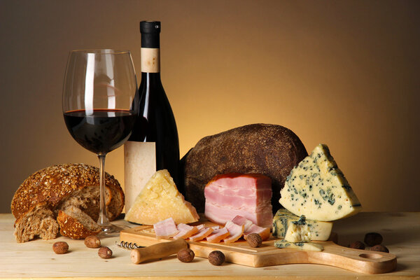 Exquisite still life of wine, cheese and meat products