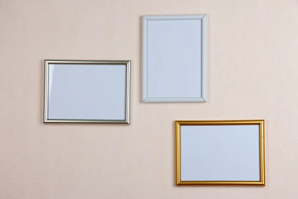 Photo frames on wall background — Stock Photo, Image