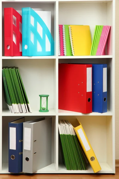 White office shelves with different stationery, close up Stock Photo