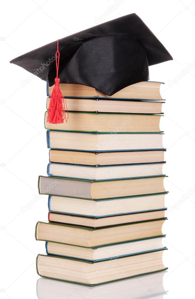 Grad hat with books isolated on white