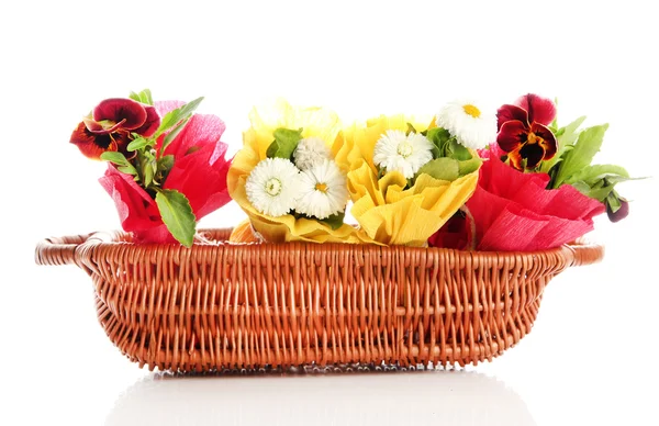 Beautiful spring flowers in basket isolated on white — Stock Photo, Image