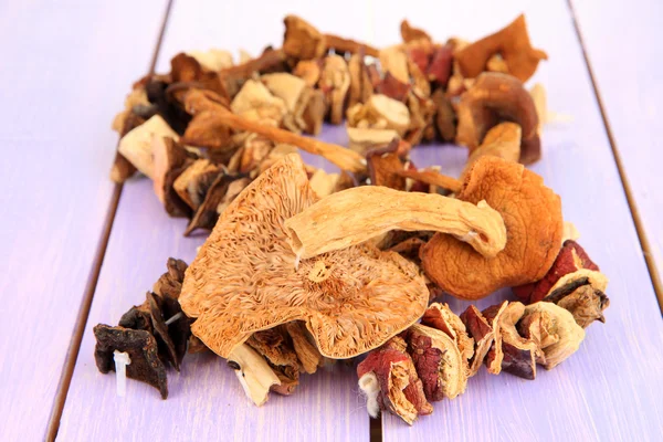 Dried mushrooms on wooden background — Stock Photo, Image