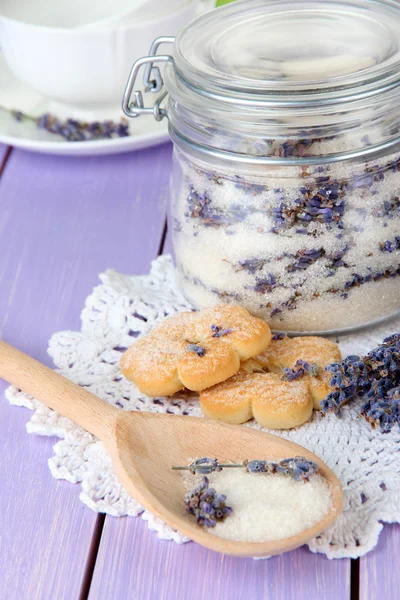 Jar of lavender sugar and fresh lavender flowers on wooden background — Stock Photo, Image