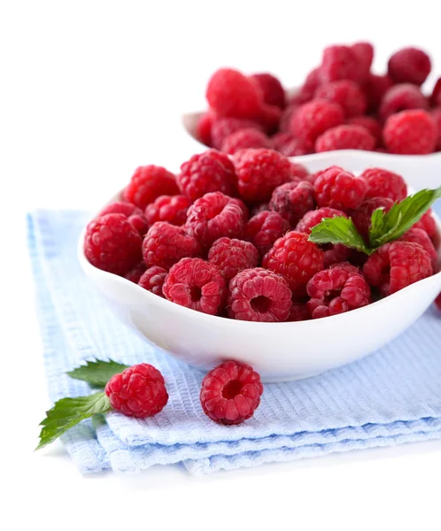 Ripe sweet raspberries in bowls, isolated on white — Stock Photo, Image