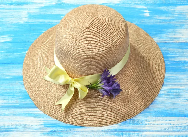 Beautiful summer hat on blue wooden background — Stock Photo, Image