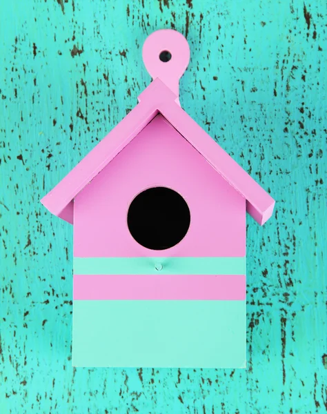 Decorative nesting box on color wooden background — Stock Photo, Image