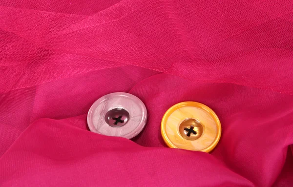 Dois botões no fundo rosa — Fotografia de Stock