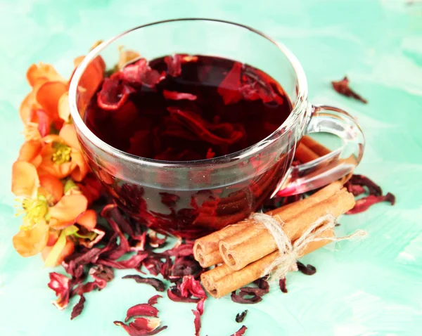 Herbal tea in glass cup, on color wooden background — Stock Photo, Image