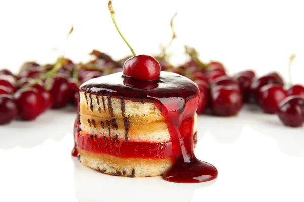 Tasty biscuit cake with jam and berries isolated on white — Stock Photo, Image