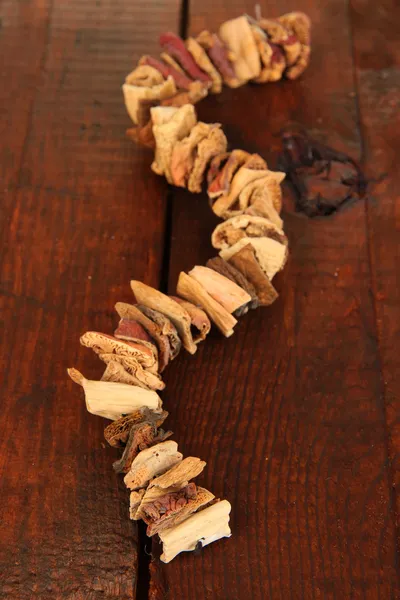 Dried mushrooms on wooden background — Stock Photo, Image