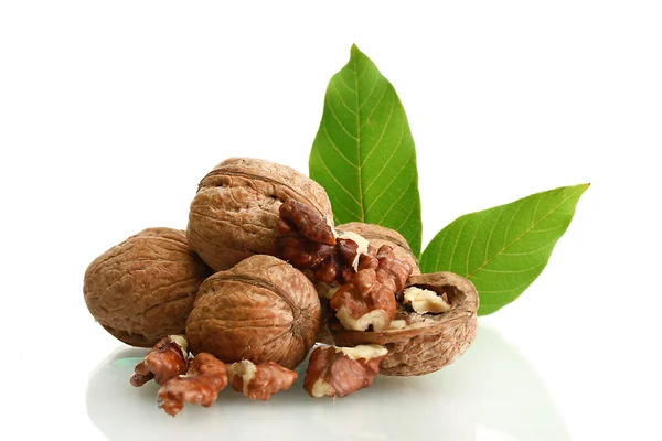 Walnuts with green leaves, isolated on white — Stock Photo, Image