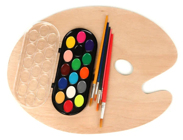 Wooden art palette with brushes for painting and paints isolated on white — Stock Photo, Image