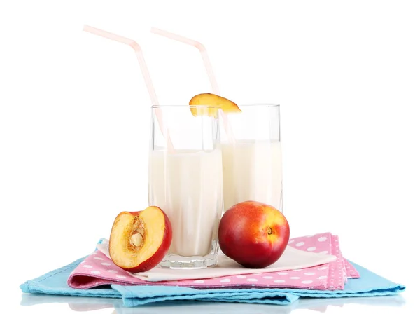 Delicious milk shakes with peach isolated on white — Stock Photo, Image