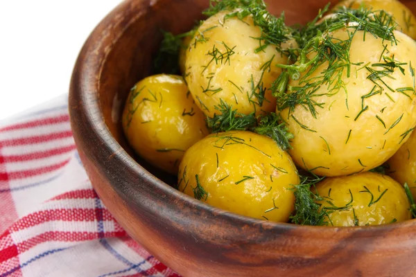 Boiled potatoes on wooden bowl on napkins — Stock Photo, Image