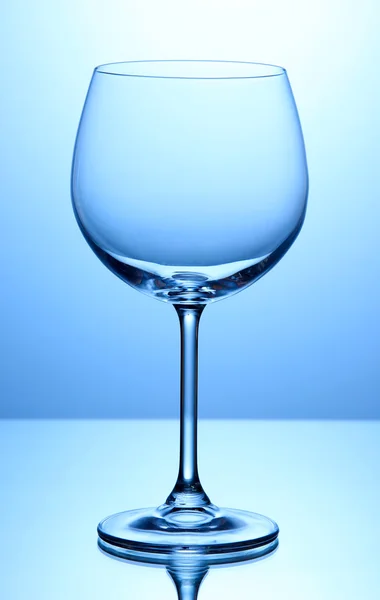 Empty wine glasses arranged on blue background — Stock Photo, Image