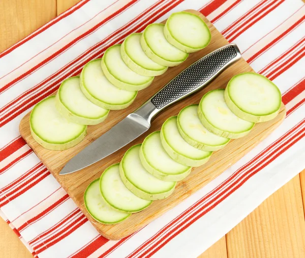 Fresh marrows on cutting board, on wooden background — Stock Photo, Image