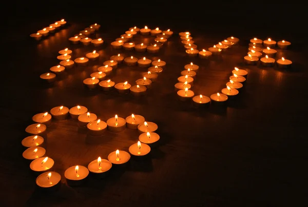 Romantic candles on dark background — Stock Photo, Image