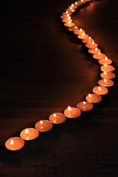 Burning candles on dark background — Stock Photo, Image