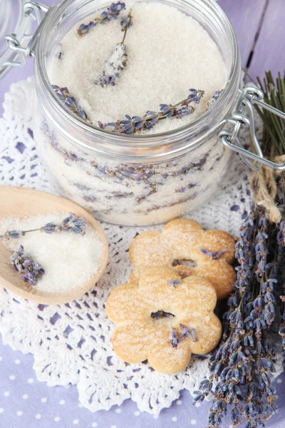 Jar of lavender sugar and fresh lavender flowers on wooden background — Stock Photo, Image