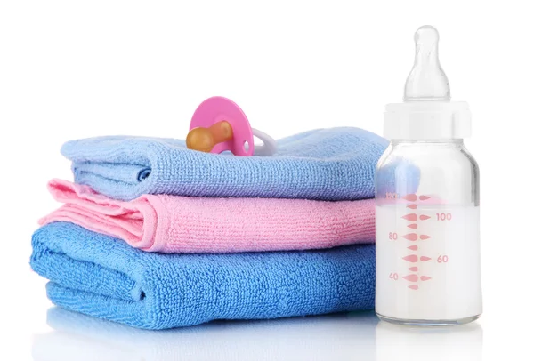 Bottle for milk with towels and nipple isolated on white — Stock Photo, Image