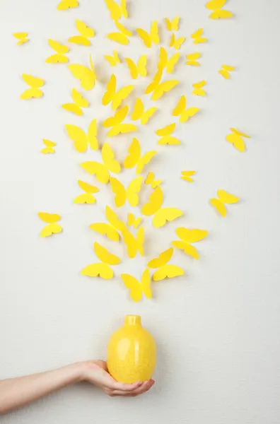 Paper yellow butterflies fly out of vase — Stock Photo, Image