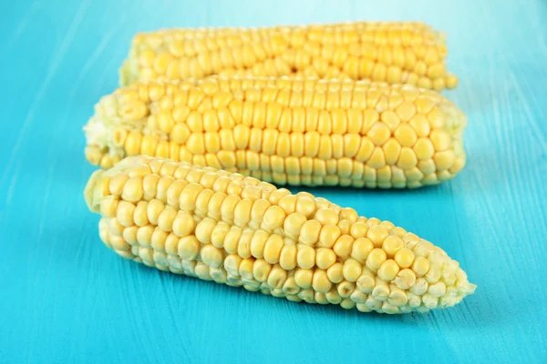 Fresh corn on color wooden background — Stock Photo, Image