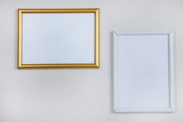 Photo frames on wall background — Stock Photo, Image