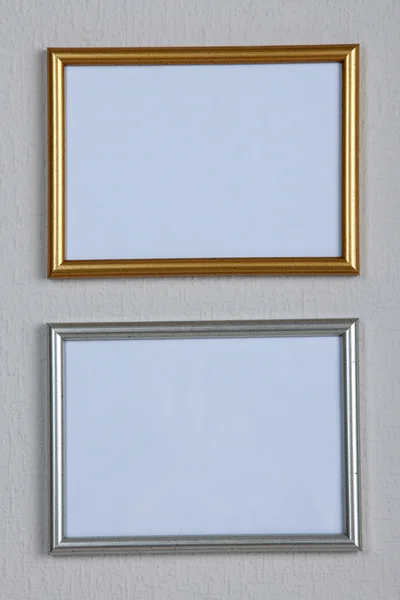 Photo frames on wall background — Stock Photo, Image