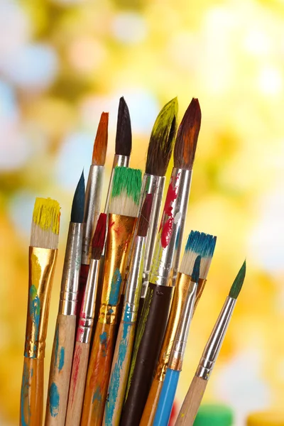 Many brush in paint on nature background — Stock Photo, Image