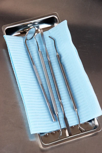 Dentist tools on grey table close-up — Stock Photo, Image