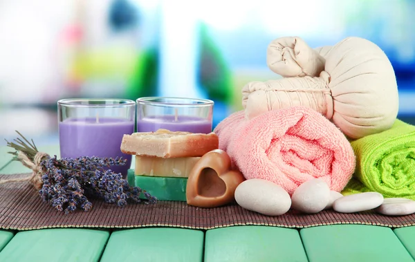 Still life with lavender candle, soap, massage balls, soap and fresh lavender, on bright background — Stock Photo, Image